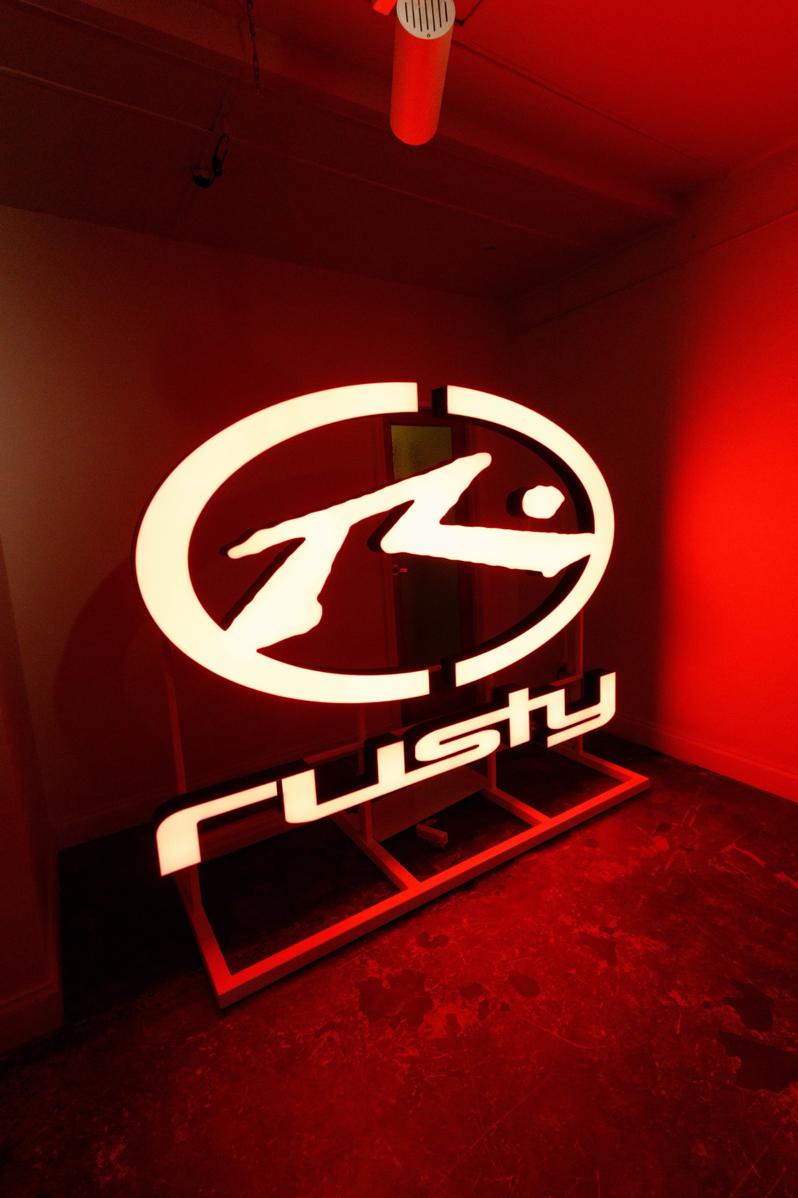 Rusty illuminated logo installation at Beyond The Valley